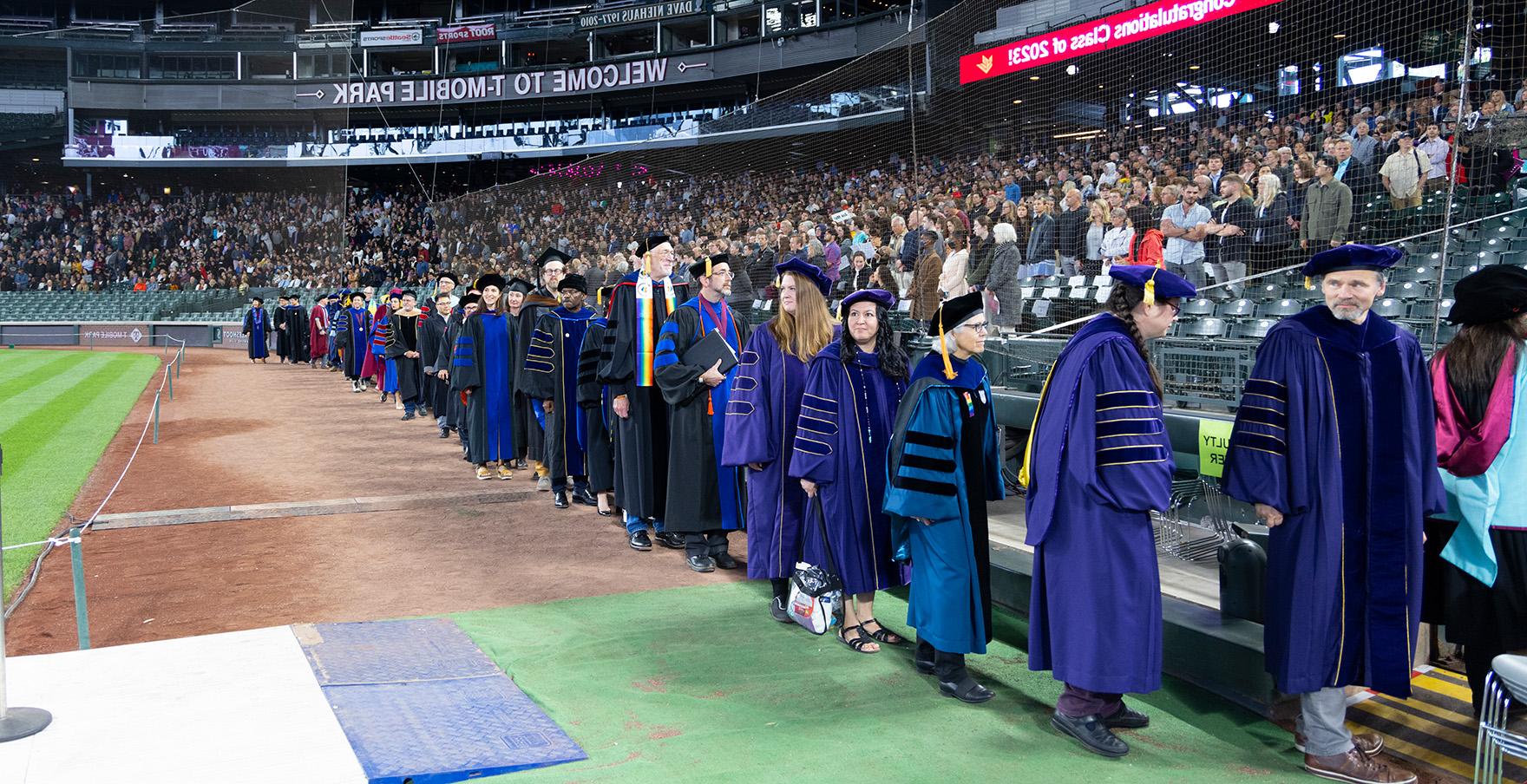 SPU faculty file into T-mobile Park | photo by Mike Siegel